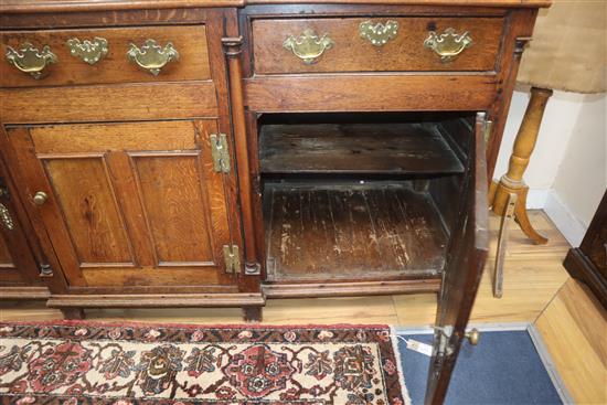 An early 19th century oak breakfront dresser base W.184cm